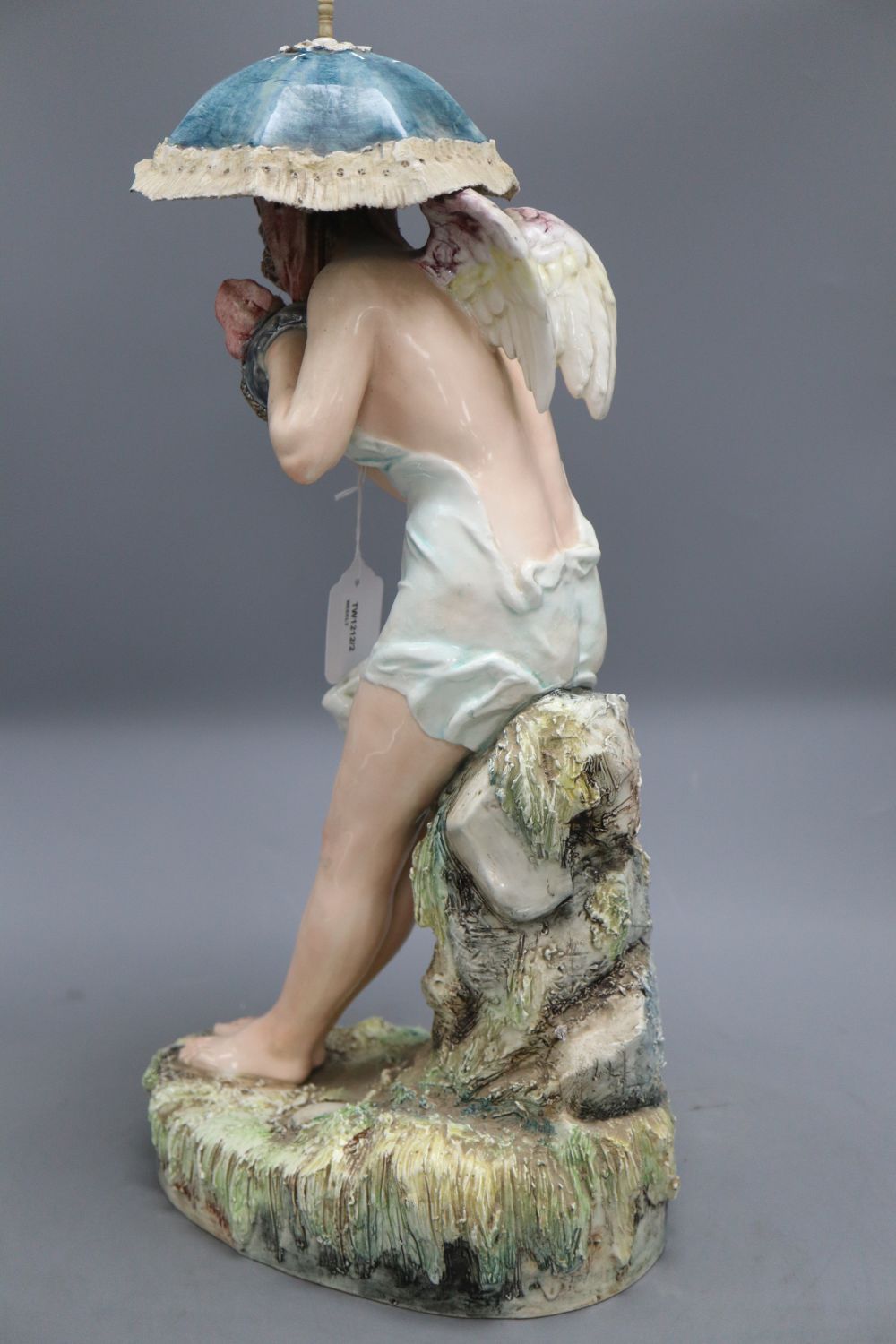 A Continental large pottery figure of a winged nymph,